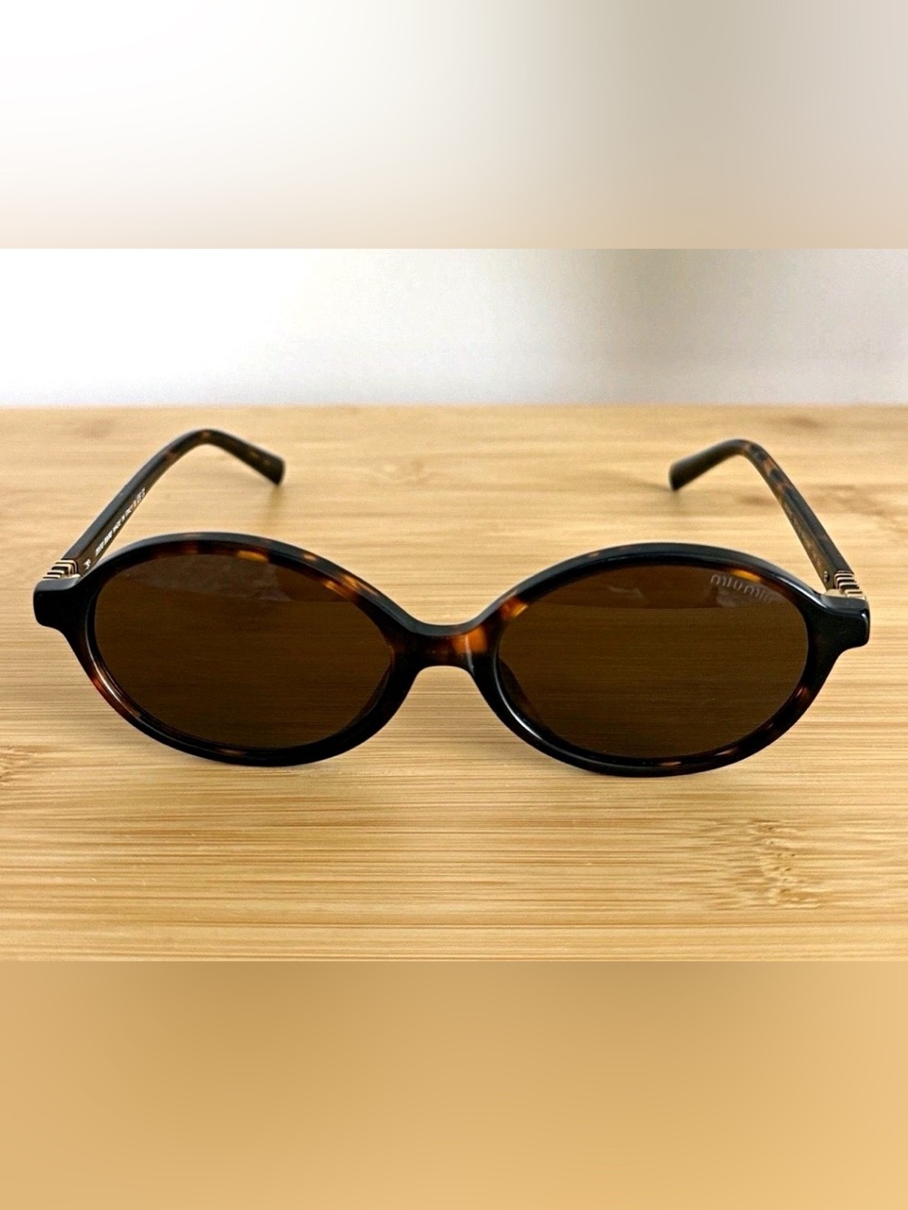 Miu Miu Tortoiseshell Oval Sunglasses with Brown Lenses